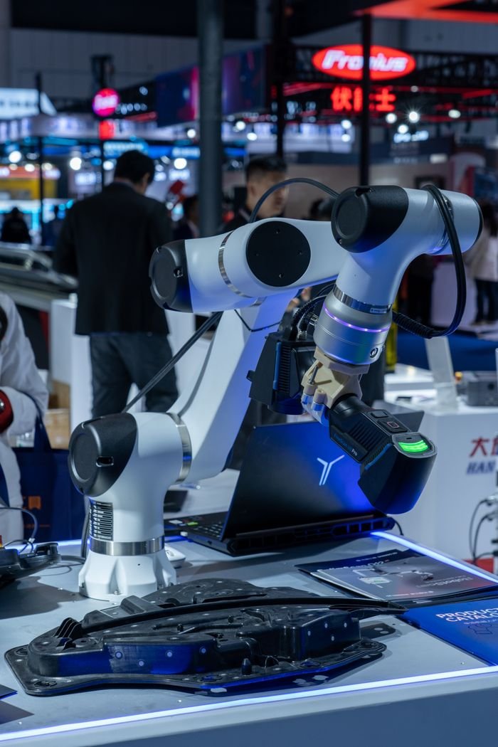 Close-up of advanced robotic arms at a technology expo showcasing automation and innovation.